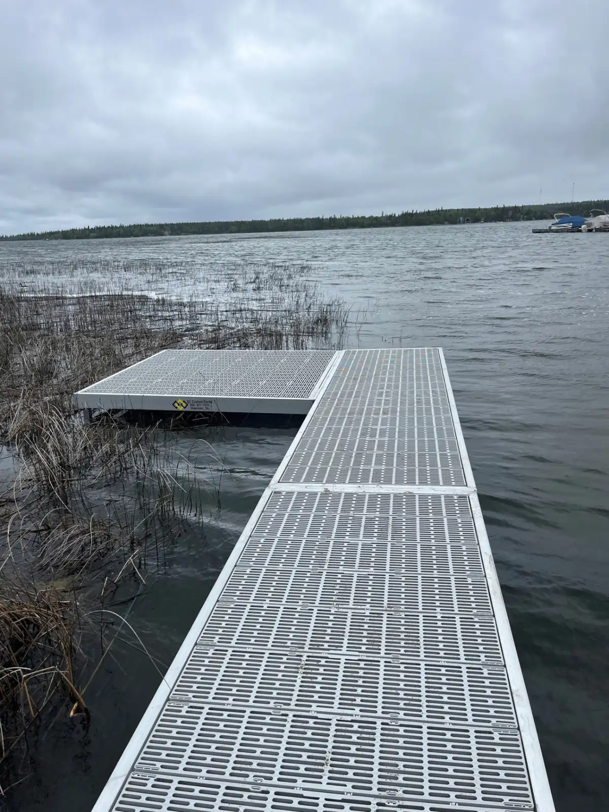 ThruFlow aluminum dock with side swim platform in marshland shallows